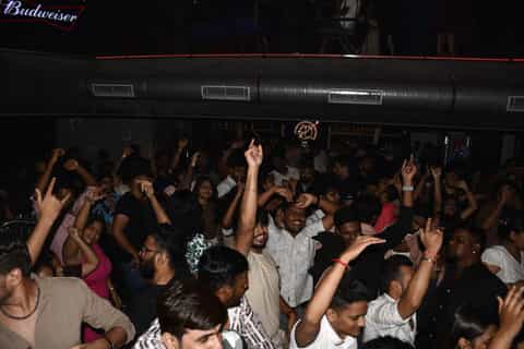 Crowd with hands raised at a Delhi club night